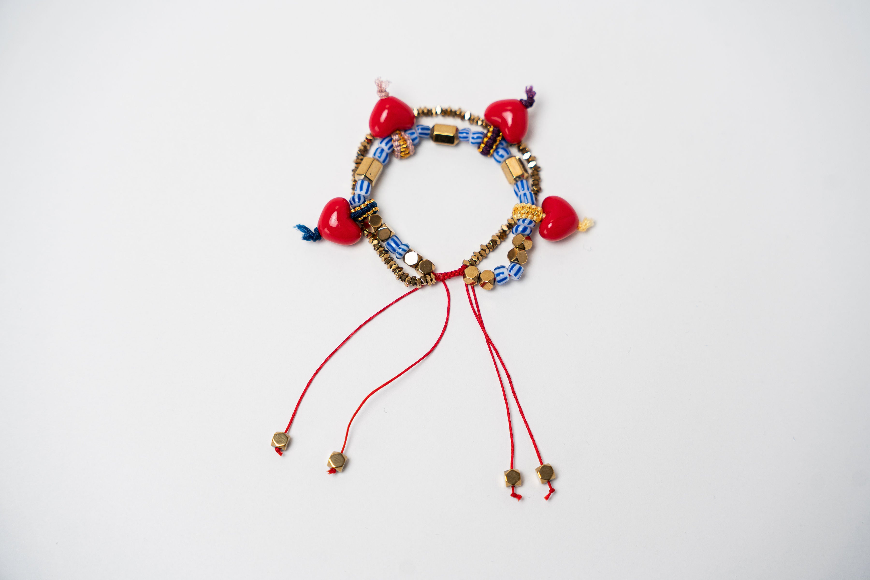 PULSERA PIEDRAS DORADAS DIJE DE CORAZONES