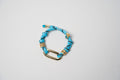 PULSERA CORDÓN AROS DORADOS