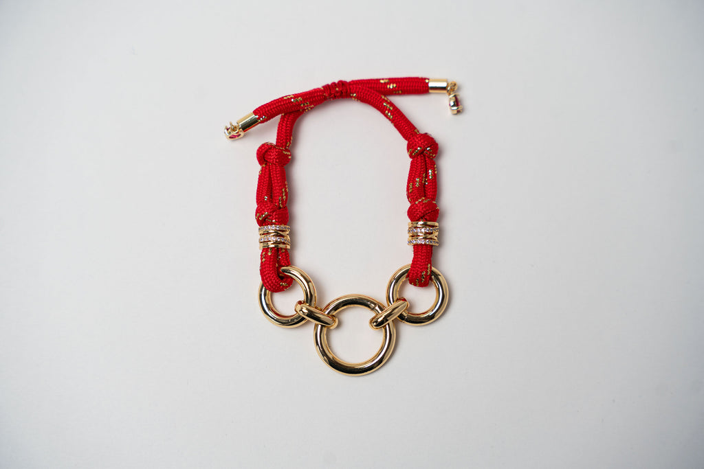 PULSERA CORDÓN AROS DORADOS
