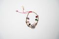 PULSERA PIEDRITAS VARIAS PIEDRITAS Y DIJE